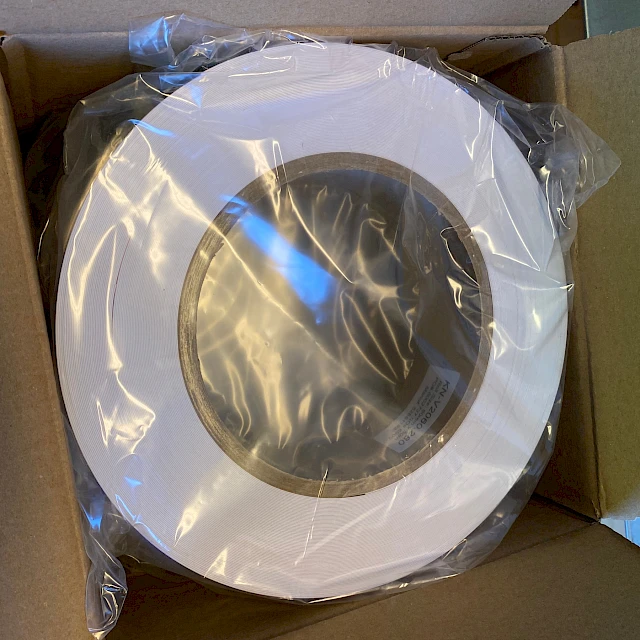 White roll in plastic inside carton top view