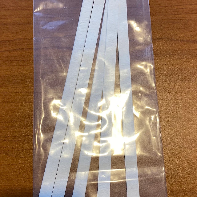 White strips in labeled plastic bag