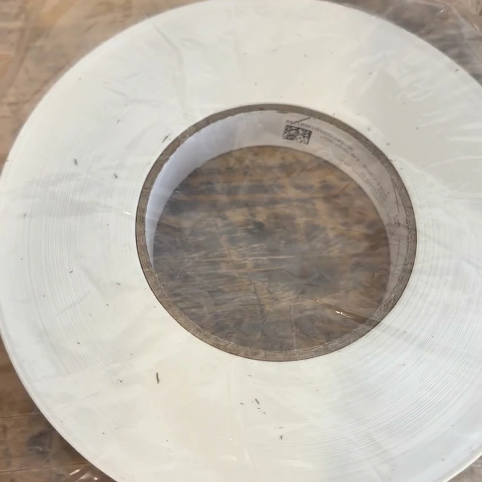 White tape roll in bag on workbench