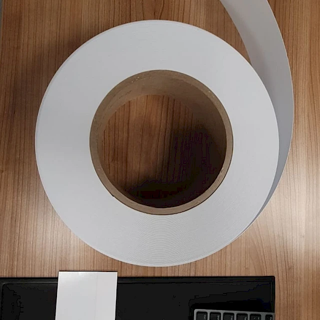 White tape roll unrolled on desk