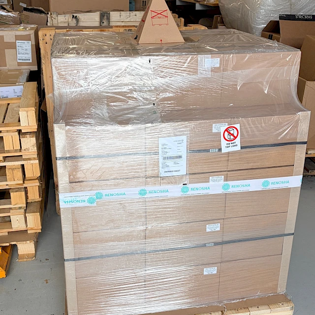 Wrapped pallet cartons in warehouse