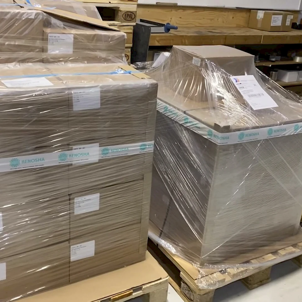 Wrapped pallets of boxes in warehouse