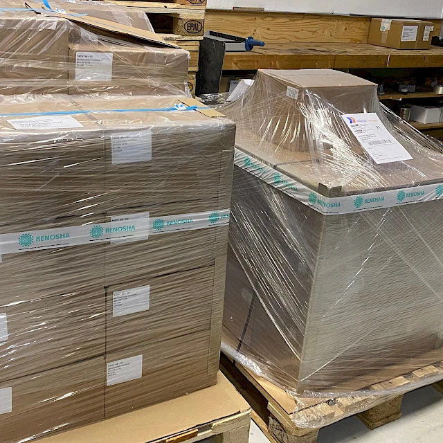 Wrapped pallets of boxes in warehouse