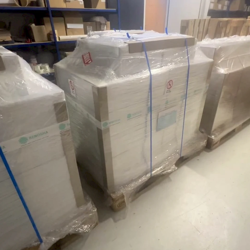 Wrapped pallets of sheets in warehouse