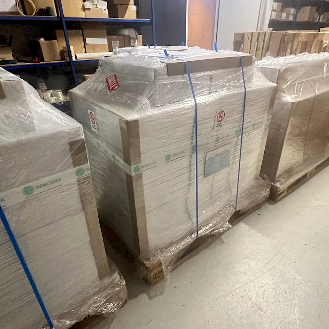 Wrapped pallets of sheets in warehouse