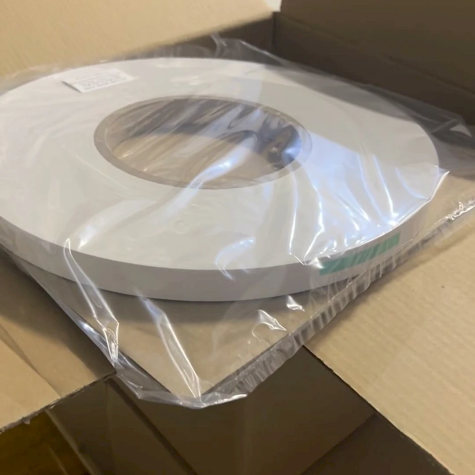Wrapped white roll in open box warehouse