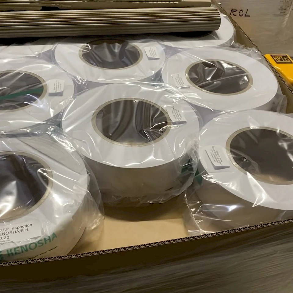 Wrapped white rolls carton on pallet