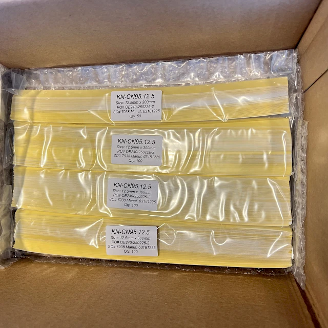 Yellow backing card packs in bubble wrap box